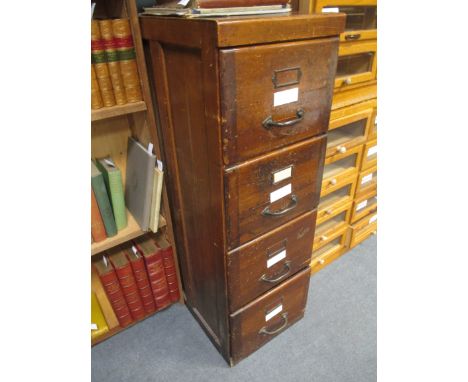 An oak upright filing cabinet, 130 x 43 x 69cm and a light oak desk, 77 x 152 x 84cm (2)  