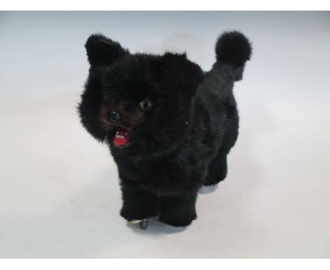 A clockwork automaton cat, finished in black rabbit fur, possibly by Roullet et Decamps, 44cm long 24cm high  