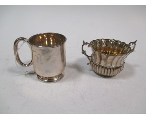 A small silver sugar basin by H Matthews, Birmingham 1896 and a small silver christening mug by E Viner, Sheffield 1940, 6oz 