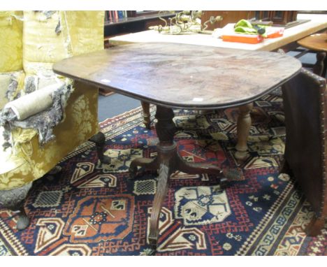 A 19th century mahogany tilt top occasional table on wrythen turned column, tripod base with spade feet and brass castors 76 