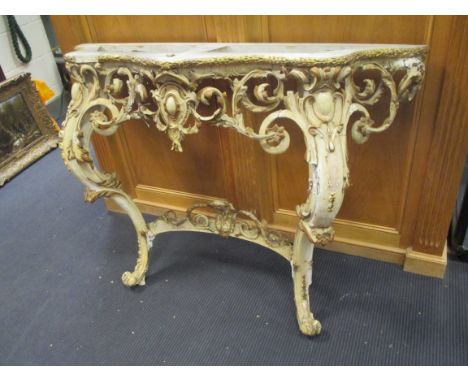 A Louis XV style console table, giltwood and painted carved and pierced with acanthus (lacking top), 120cm wide  