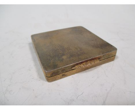 A small square silver powder compact, by William Neale, Birmingham 1935  