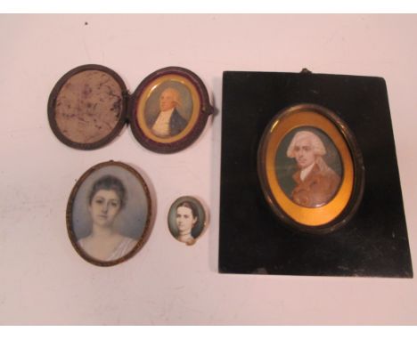 Two Georgian portrait miniatures of gentleman, anEdwardian miniature of a young lady and a painted over photograph of a young