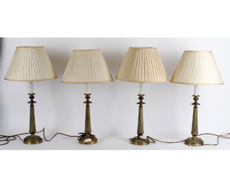 
	
		A modern set of four brass column table lights, of candlestick form, 51.5cm high to top of electrical fitting (4).
		
		