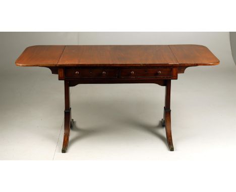 
	
		An early 19th century mahogany sofa table, of conventional twin drop leaf form, with ebonised stringing throughout, twin