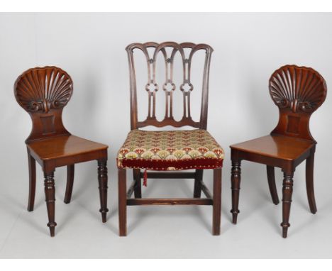 
	
		A pair of early Victorian mahogany shell back hall chairs, after a design by Gillows, 39cms wide, 85.5cms high, 44.5cms 