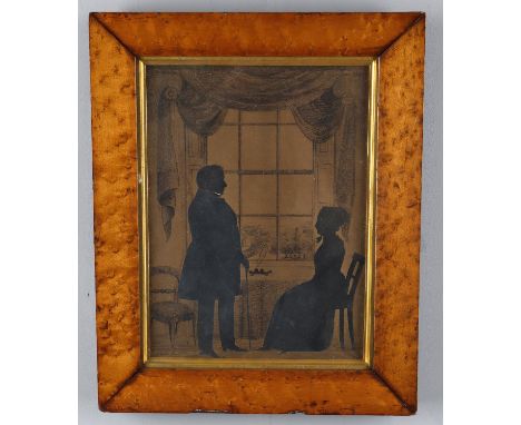 
	
		M Lock (Anglo-Irish mid-19th century), a pair of silhouette portraits, each with cut-out full-figure silhouette pictures