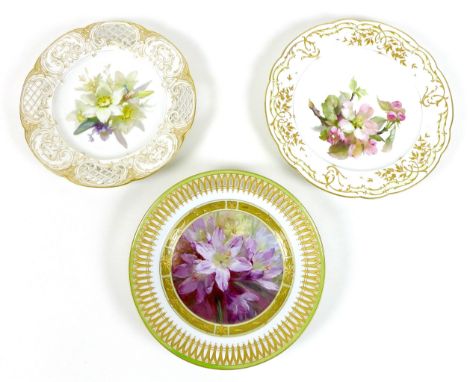 A group of three early 19th century Berlin factory porcelain cabinet plates, two with reticulated rims, finely decorated with