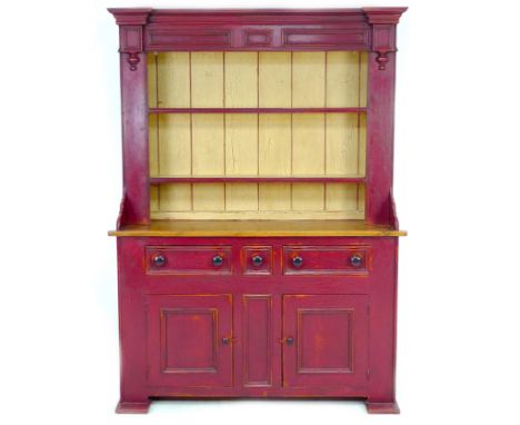 A modern painted pine sideboard, with two shelf closed back plate rack below a moulded cornice and flanking pillars, the base