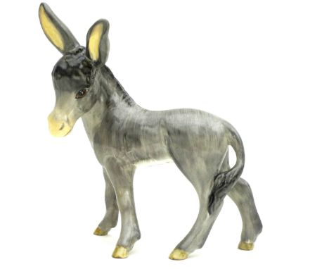 A Wedgwood &amp; Co. Ltd ceramic figurine, modelled as a donkey in standing pose, 18.5 by 16cm long.