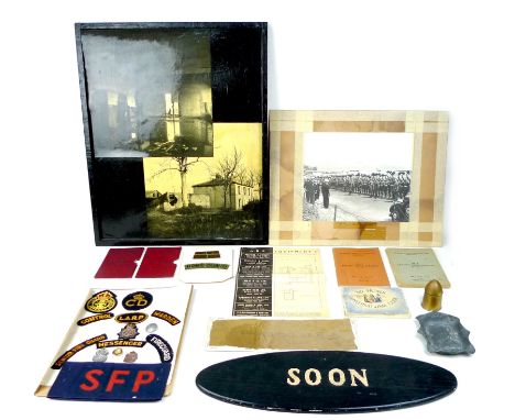 A collection of military ephemera and badges, including badges for the A.R.P., Civil Defence Corps, Home Guard, and WLA, a br