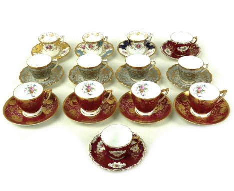 A group of thirteen Coalport and Minton coffee cans and saucers, comprising nine Coalport cans and saucers including four in 