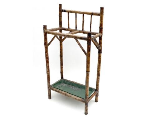 A Edwardian bamboo stick stand, two division, with green metal drip tray, 43 by 23 by 88cm high.