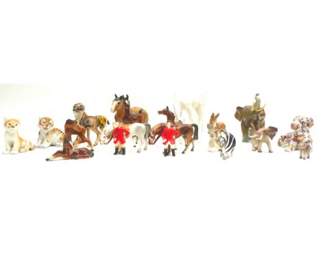 A collection of ceramic animal figurines, mostly German, including a Royal Dux elephant, 22cm by 10cm by 17.5cm high, a Goebe