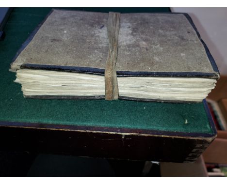 A Hand Written Arabic Religious Book, the script comprises of ornate lettering in different coloured Ink, with Hard Loose cov