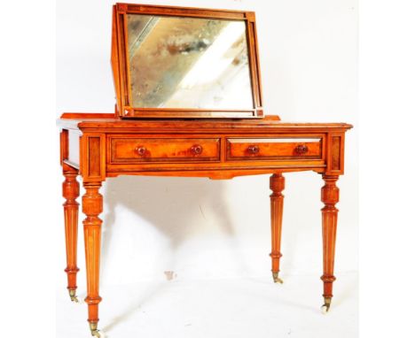 A Victorian 19th century mahogany dressing table bt Bell &amp; Coupland of Preston, England.&nbsp; Raised on reeded tapering 