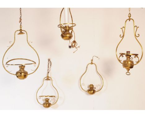 An assortment of 19th century Victorian ornate celling light fixtures to include a selection of pendant hanging lantern oil l