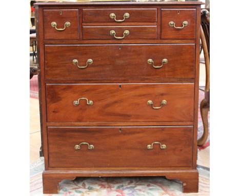 An Edwardian mahogany chest of drawers, fitted with two small, two short and three long graduated drawers, raised on bracket 
