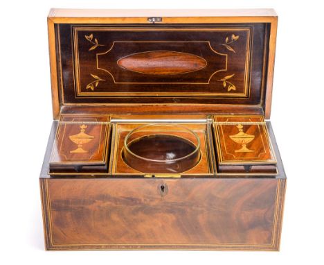 A George III flame mahogany tea caddy, circa 1810, of rectangular form with satinwood stringing and crossbanding, inlaid and 