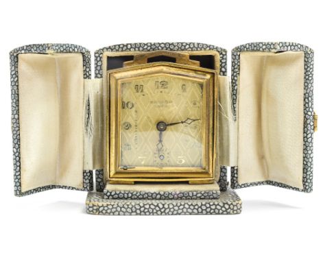 An Art Deco Bayard Luxe travel alarm clock, circa 1930's, gilt metal in a shagreen simulated fitted case, height 7cmCondition