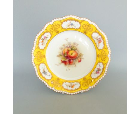 A  rare Royal Worcester  yellow ground plate  painted with  fruit in the centre  signed by William Ricketts and the  gilt bor