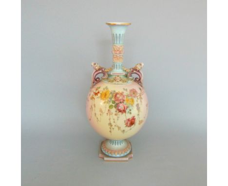 A large Royal Worcester prismatic vase decorated with flowers and sprays  on a  delicately coloured  background,  lion head h