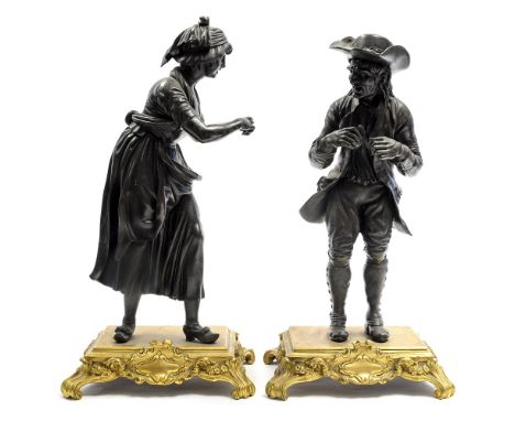 A pair of 19th Century French bronze figures, circa 1880, man in a hat and his woman companion, standing on raised integral o