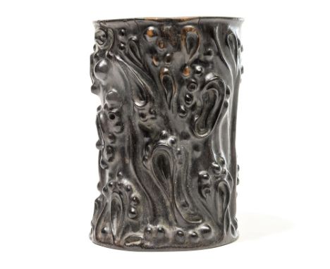 A Chinese hardwood cylinder brush pot, possibly 17th Century, high relief carved to simulate a knarled tree trunk, height 12c