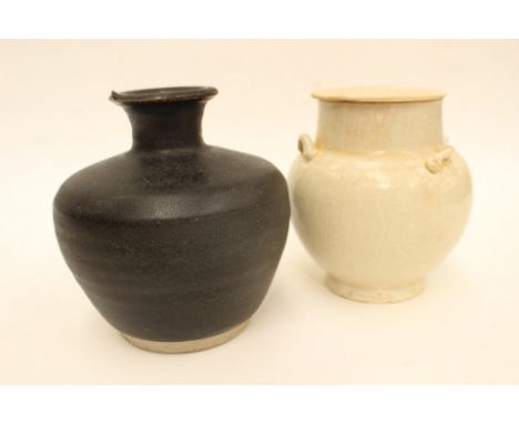 A Chinese Shufu type lugged jar and cover, Song Dynasty or later, with four applied shoulder lugs to the compressed cushion b