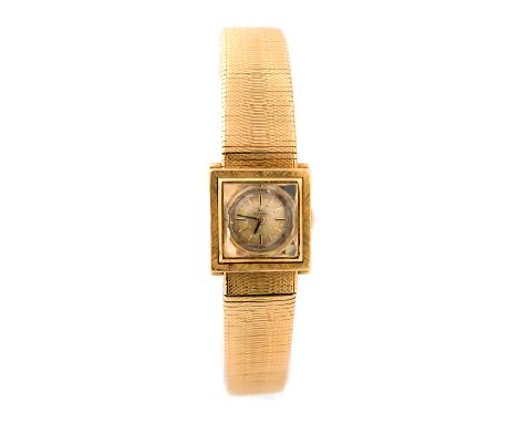 Omega, a ladies 18ct gold Omega wristwatch, 2cm square outer dial dial, engraved bezel with circular dial having baton numera