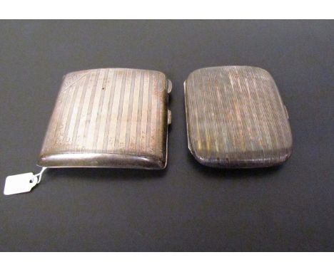 Two engine turned cigarette cases, one by S. Blauchensee &amp; Son Ltd., Birmingham 1929, initials to corner, the other marke
