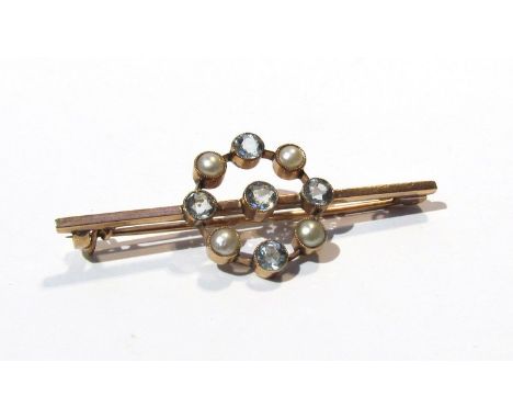 An aquamarine and pearl set bar brooch, unmarked