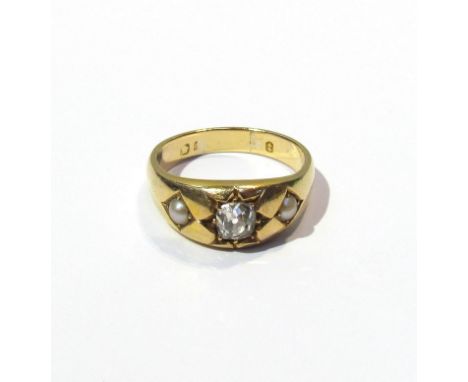 A gypsy ring the centre diamond approximately .50ct of flanked by seed pearls, marks rubbed   