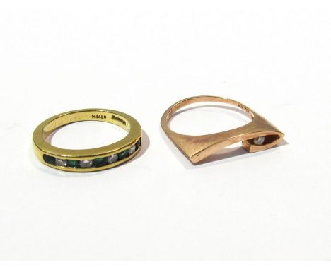 A gold emerald and diamond chip half hoop ring and gold modernist ring (2)