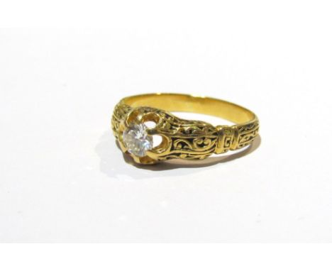 A 19th Century diamond solitaire ring with ornate engraved shank approx .50ct possibly French 