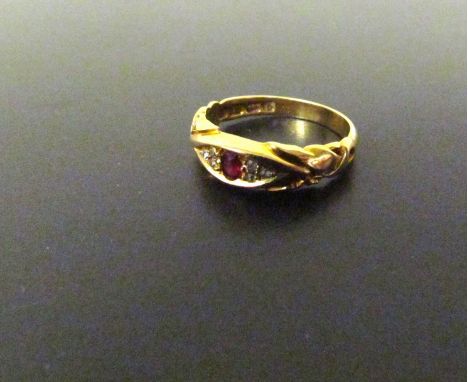 An 18ct ruby and diamond chip ring 