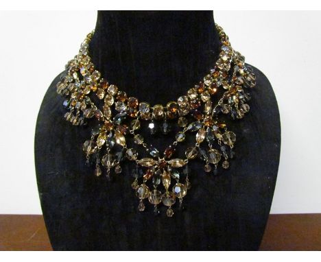 A vintage Christian Dior festoon necklace in varying shades of amber coloured crystal, stamped Christian Dior 1961