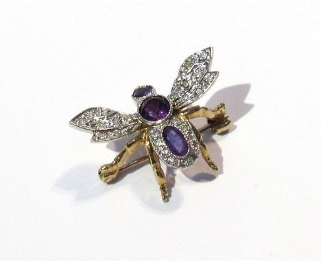 A gold brooch/ pendant as a bee set with diamonds and amethyst 