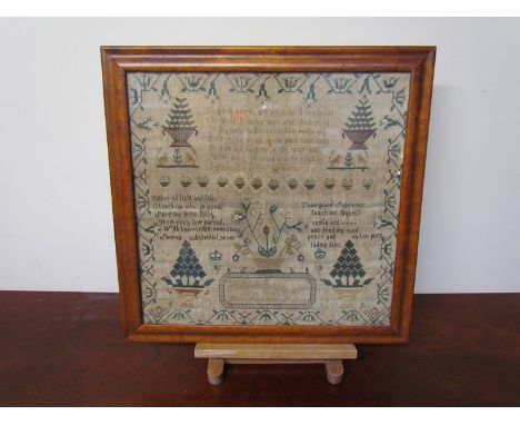 An early 19th Century sampler with verse, trees and decorative border. 42cm x 43cm