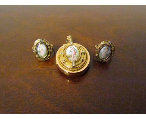 A gold oval locket with hair panel to interior the front with panel depicting young female in a rope twist and seed pearl fra