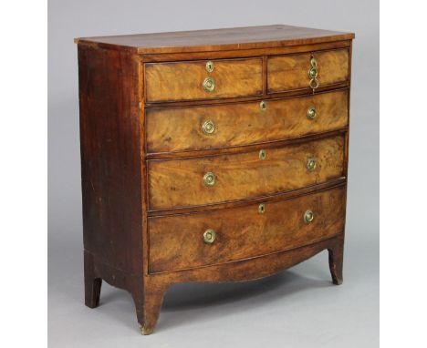 A Victorian mahogany bow-front chest fitted two short &amp; three long graduated drawers with brass ring handles, on turned t