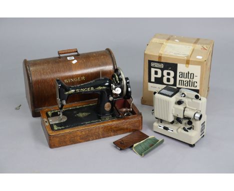 A Singer hand sewing machine with an oak case, &amp; a Eumig “P8” cine projector, boxed.