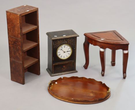 An Edwardian mahogany oval tea tray with brass side handles, 22” x 16”, a small clock dial to the hinged front, 16” x 11”; a 