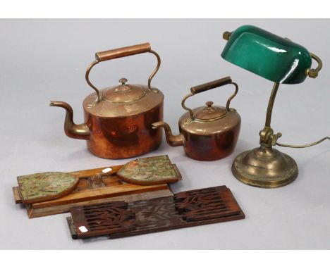 An Edwardian-style brass desk lamp with a green tinted glass revolving shade, &amp; on a pedestal foot, 14” high; together wi