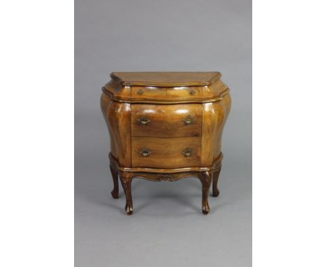 An 18th century style Italian walnut small bombé commode with marquetry decoration, fitted three drawers, on cabriole legs. 