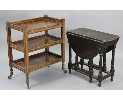 A 1930’s oak three-tier tea trolley on square supports with castors, 29¾” wide x 36” high x 17¾” deep; &amp; a 1930’s oak ova