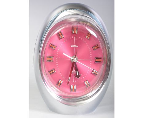 An original 20th Century retro vintage Japanese made space age oval egg alarm clock having&nbsp;chrome body with vibrant pink