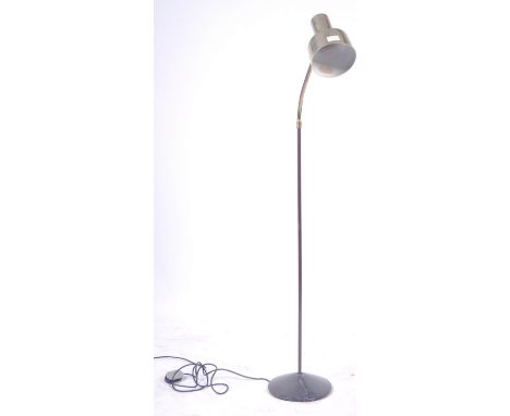 A retro vintage 20th Century industrial floor standing lamp light having a polished brass pendant shade raised on a gooseneck