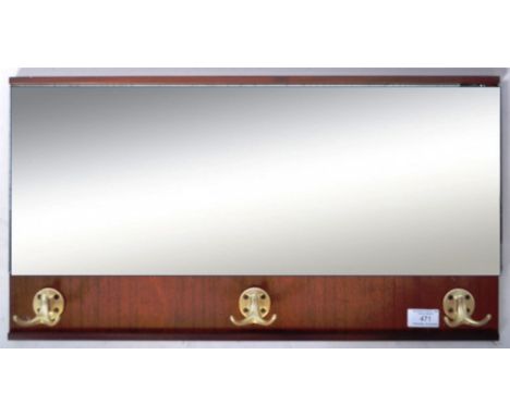 A retro vintage 20th Century mirrored teak wall hanging hallway coat / hat rack of rectangular form having a single mirrored 