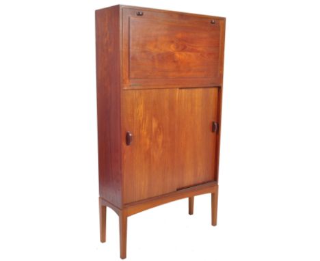 A good retro vintage mid 20th Century Danish inspired teak wood&nbsp;drinks / cocktail cabinet having a full front serving se